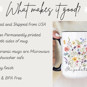 May include: A white ceramic mug with a dark blue handle and rim, featuring a colourful watercolour-style floral bouquet illustration and the name Elizabeth printed in black script lettering on the front surface of the mug.