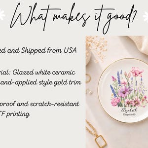 May include: A round white ceramic dish with a gold-coloured rim, featuring a colourful floral illustration of pink, purple, and blue wildflowers. The text "Elizabeth" and "Chapter 60" is printed in black script and sans-serif font below the flowers.