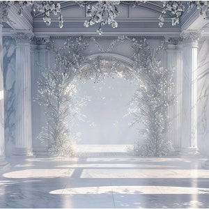 May include: A white, marble archway with white floral decorations, surrounded by white marble columns. The archway is in a large, white room with a white tiled floor.
