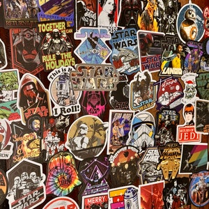 May include: A collection of Star Wars themed stickers featuring various characters, scenes, and logos. The stickers are colorful and feature a variety of styles, including cartoon, realistic, and abstract.