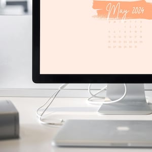 Plano de fundo laranja para desktop de abril de 2025
