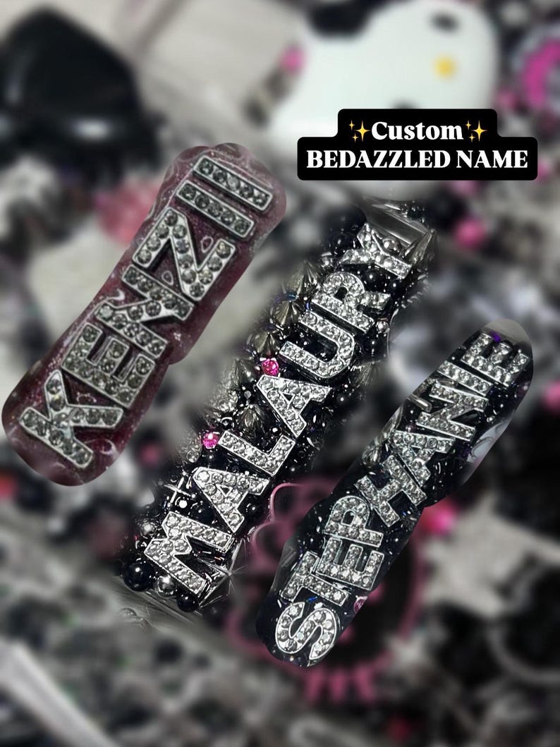 May include: Three custom bedazzled name accessories. The names are spelled out in silver rhinestones on a dark background. The text "Custom Bedazzled Name" is in a black rectangle.