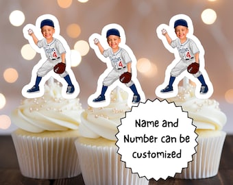 May include: Three baseball-themed cupcake toppers with a boy's face on each. The toppers are on top of cupcakes with white frosting and pearl sprinkles. The text on the bottom says "Name and Number can be customized".