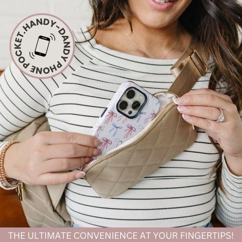 May include: A quilted crossbody bag with a phone pocket. The bag is beige and has a quilted pattern. The phone pocket is on the front of the bag and has a black and white phone case with a bow pattern. The text "Pocket. Handy-Dandy. Phone" is on the phone pocket.