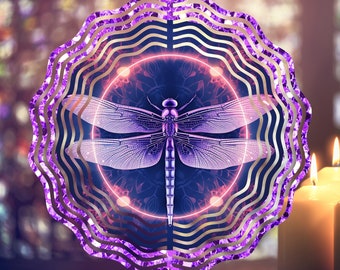 May include: Purple metal dragonfly wind spinner with a mandala design in the center. The wind spinner has multiple layers of metal that create a swirling effect.