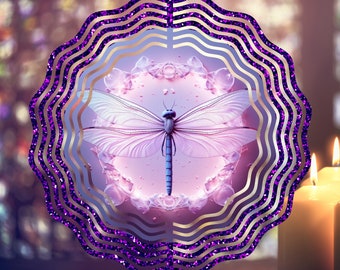 May include: Purple metal wind spinner with a dragonfly design. The dragonfly is surrounded by a circle of pink flowers and has a light blue body.