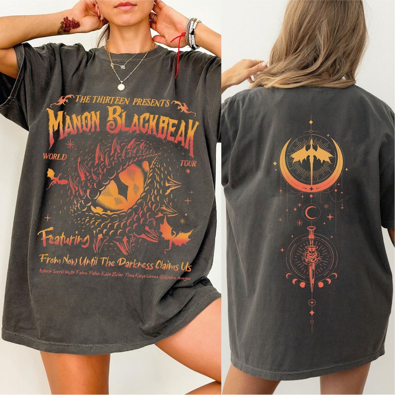 a woman wearing a black shirt with a dragon on it
