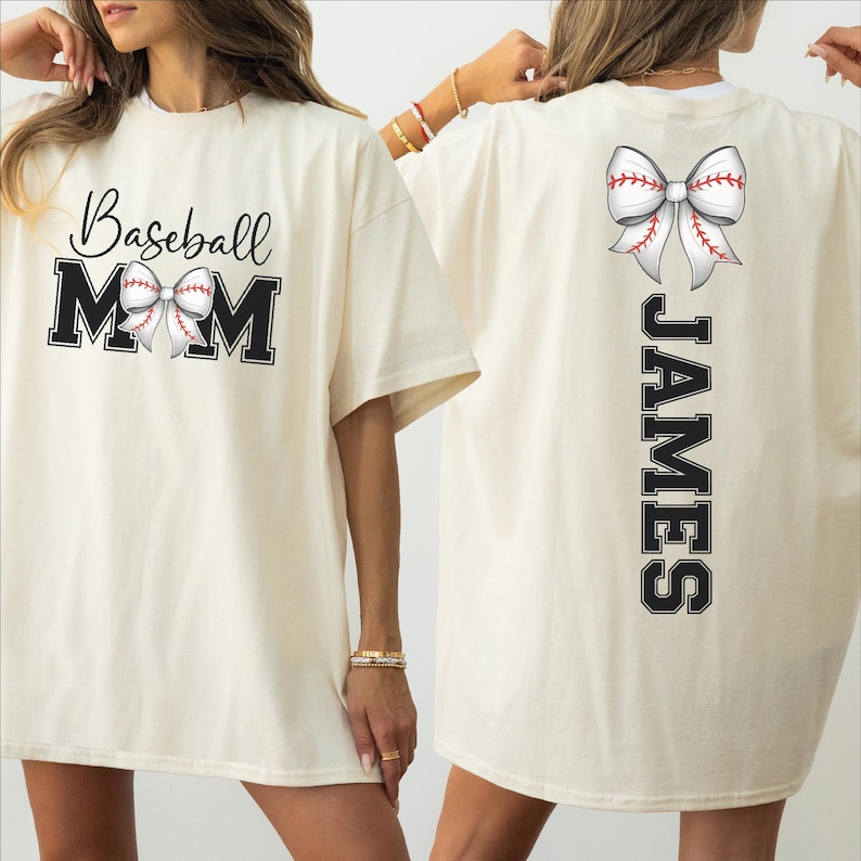 A woman wearing a white t-shirt with the text "Baseball Mom" and a baseball graphic, along with the name "James" printed on the back.