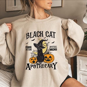 Black Cat Apothecary Halloween Sweatshirt, Cute Witchy Vibes Sweatshirt, Halloween Black Cat Sweatshirt, Cat Lover Hoodie, Halloween Gift