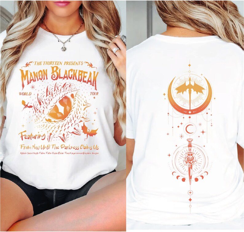 a woman wearing a white shirt with a design on it