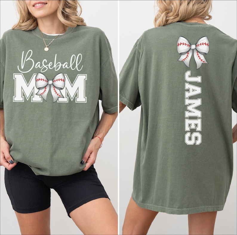 A woman wearing a green t-shirt with the text "Baseball Mom" printed on it, along with a bow on the back.