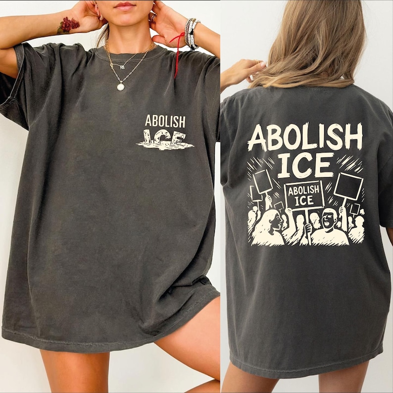 a woman wearing a shirt that says abollish ice