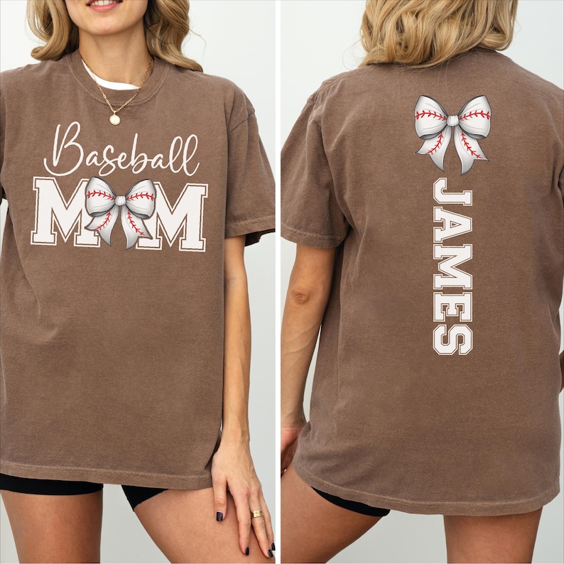 A woman wearing a brown t-shirt with the text "Baseball Mom" and a baseball graphic on the front, and the name "James" printed on the back.