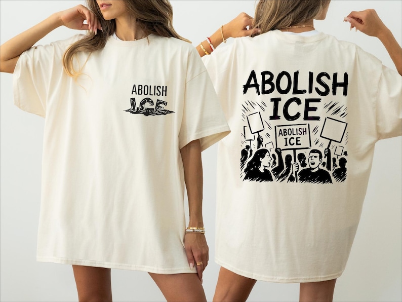 two women wearing t - shirts that say abollish ice