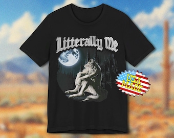 May include: Black t-shirt featuring a wolf sitting in front of a full moon and a castle. The text "Literally Me" is above the graphic. A "USA Made" sticker is on the right side.