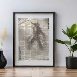 May include: A black framed print of a drawing of a character from "The Lord of the Rings" by J.R.R. Tolkien. The drawing is on a background of printed text. The text at the top of the print reads "Chapter Four".