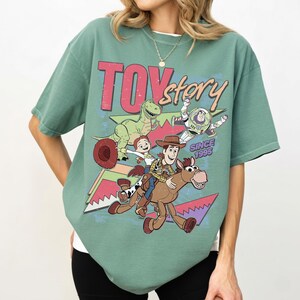 Disney Toy Story 1995 Retro Comfort Colors Shirt, Woody Buzz Lightyear Rex Tee, WDW Disneyland Family Vacation 2026 Trip, Disney Pixar Fest Light Green