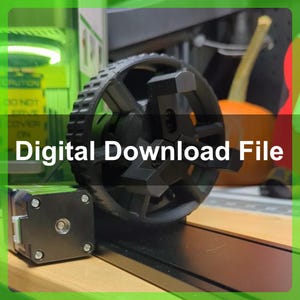 May include: A black 3D printed wheel with a gear design and a black motor attached to it. The wheel is on a black surface with a wooden surface underneath. The text "Digital Download File" is in the image.