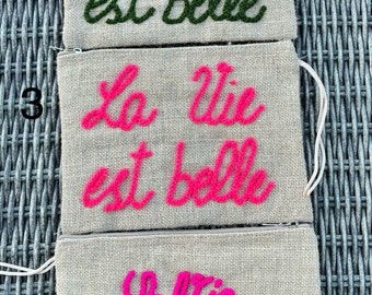 Burlap pouch embroidered life is beautiful.