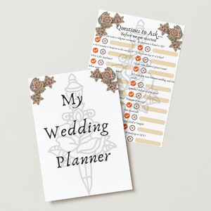May include: A wedding planner booklet with a black and white illustration of a dagger and rose. The cover says "My Wedding Planner". The booklet includes a checklist of questions to ask before planning a wedding.