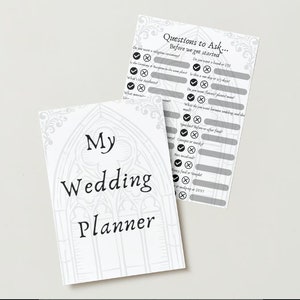 May include: A white wedding planner with a gray and white floral design. The cover says "My Wedding Planner". The planner includes a checklist of questions to ask before getting married.