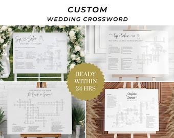 May include: Four white signs with black text and lines, each featuring a wedding-themed crossword puzzle. The signs are titled "Sip & Solve" and "How Well Do You Know The Bride & Groom?" The signs are displayed on easels against a backdrop of greenery and wood.