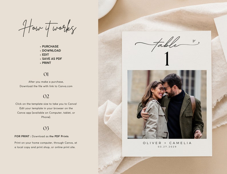 May include: A white table number card with a black handwritten font that says "table 1". A small heart symbol is next to the number. A photo of a couple is below the table number. The photo shows a man and woman embracing. The text below the photo says "OLIVER + CAMELIA 03.27.2029".