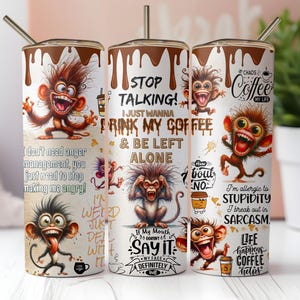 May include: A white tumbler with a brown lid and a brown stripe around the top. The tumbler features a cartoon monkey with the text "Stop Talking! I just wanna drink my coffee & be left alone."  The tumbler also features other cartoon monkeys with various sayings about coffee.