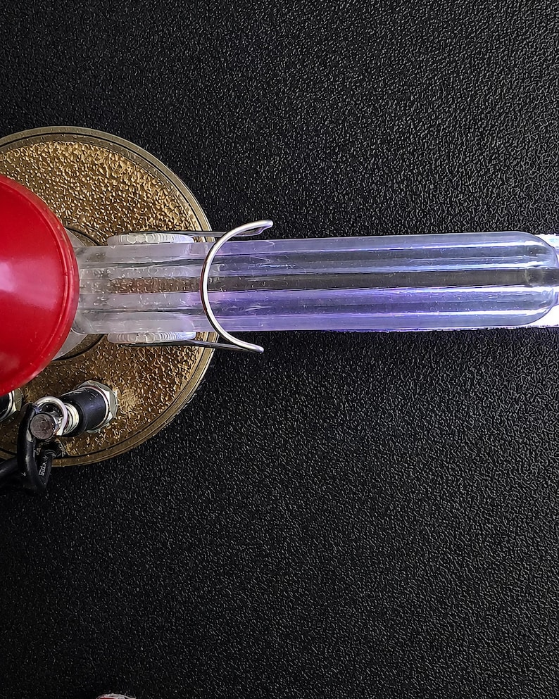 Macro of an illuminated acrylic arm tube showing the addressable LEDs inside