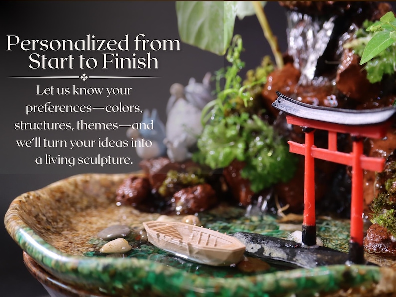 May include: A miniature zen garden with a waterfall, a red torii gate, and a small wooden boat. The garden is set in a ceramic dish with green moss and rocks. The text "Personalized from Start to Finish" is displayed above the garden.