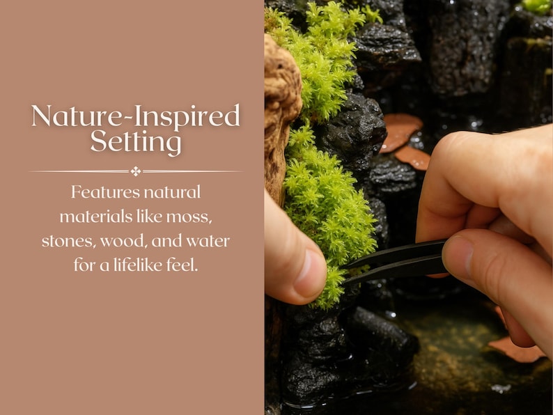 May include: A close-up of a hand using tweezers to arrange moss on a rock. The moss is green and the rock is black. The background is a brown surface with the text "Nature-Inspired Setting" and "Features natural materials like moss, stones, wood, and water for a lifelike feel."