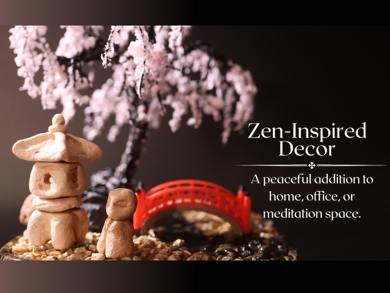 May include: A miniature Zen garden with a small pagoda, a red bridge, and a bonsai tree with pink blossoms. The text "Zen-Inspired Decor" and "A peaceful addition to home, office, or meditation space." is displayed below the garden.