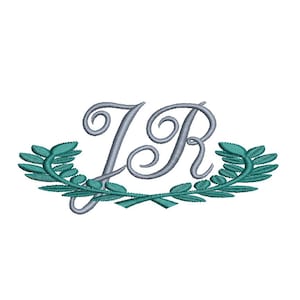 May include: An embroidered design featuring the intertwined letters "JR" in a silver-gray color, adorned with a teal-colored laurel wreath. The design is set against a clean white background, suitable for various applications.
