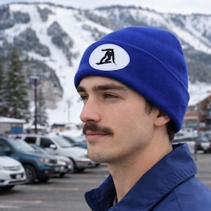 Gorro de tricô estilo snowboard com detalhe em couro