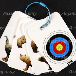 May include: Set of five white archery targets with different animal images and a bullseye target. The targets are attached together with a blue string and have the text "Allen Archery" printed on them. The bullseye target has a blue, red, yellow, and black design and the text "15M".