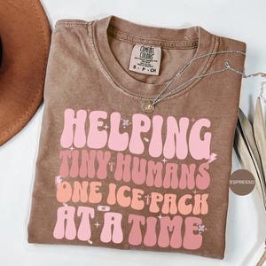 Helping tiny humans One Ice Pack At A Time Comfort Colors® Shirt, School Nurse Shirt, School Nurse Shirt, School Nurse day, best nurse gifts