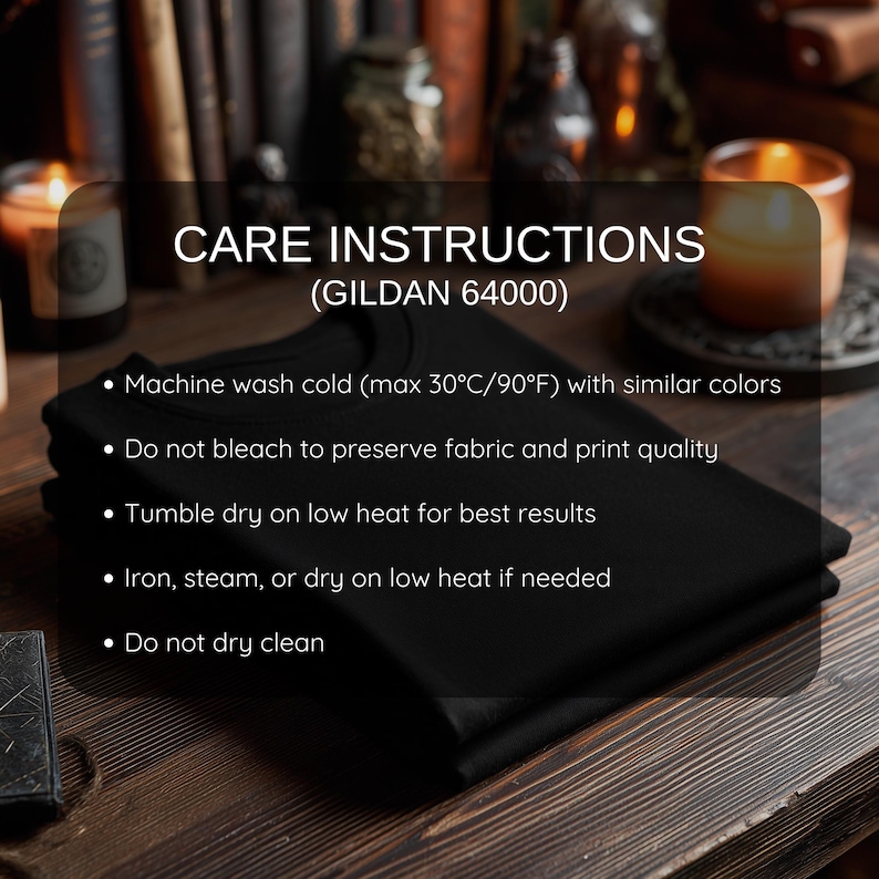 May include: A stack of black t-shirts with care instructions displayed on a black background. The text reads: Machine wash cold (max 90&deg;F) with similar colors, do not bleach, tumble dry on low heat, iron on low heat, and do not dry clean.