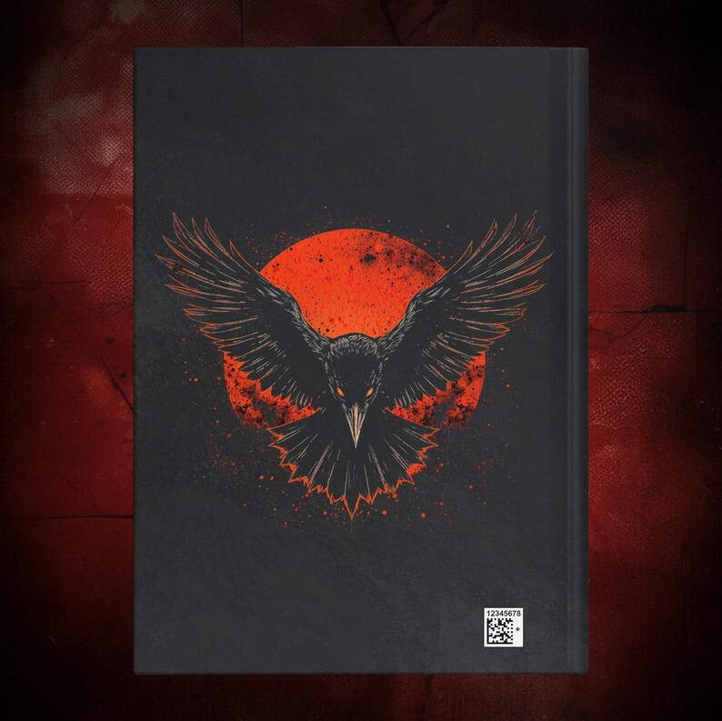 May include: Black journal featuring a detailed illustration of a raven with outstretched wings against a red sun. The raven's eyes glow, and the background has a speckled effect. A small barcode is visible at the bottom.