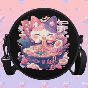 Cute round satchel bag featuring a kawaii cat enjoying a bowl of ramen, surrounded by pastel pink and purple tones. Perfect for anime girls, soft girl fashion lovers, and fans of Harajuku aesthetic. The crossbody design adds convenience, while the playful Japanese food illustration makes it a standout accessory for school, conventions, or everyday outfits with a touch of cute and cozy flair.