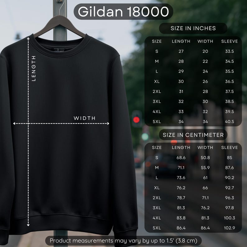 May include: A black Gildan 18000 sweatshirt hangs on a metal rack. The image includes a size chart in inches and centimeters, detailing length, width, and sleeve measurements for sizes S to 5XL. The product measurements may vary by up to 1.5 inches.