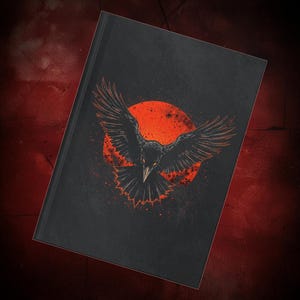 Hardcover gothic journal featuring a dramatic black raven with wings spread wide against a deep red moon on a dark textured background. This A5 notebook has a premium full wraparound print with bold, high-contrast colors and a smooth matte laminate finish. Designed for gothic women, writers, artists, and students who love dark fantasy, witchy aesthetics, and occult symbolism, perfect for journaling, notes, planning, or creative writing.