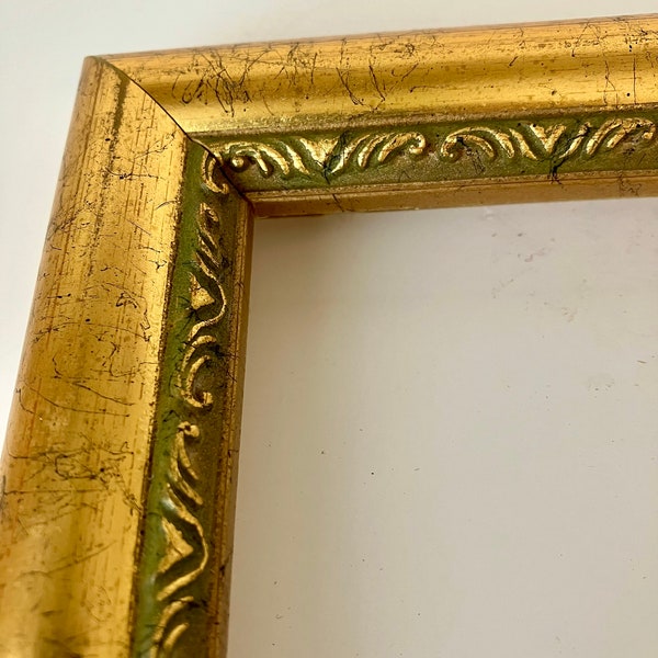 Vintage frame, gold with black, dark green detailed design. Empty, no glass. 9.75" x 11.5"  Made in Canada.