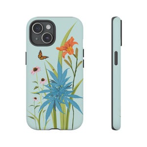 May include: A blue and green phone case with a floral design. The design features a butterfly, a lily, and a cannabis plant. The background is a light blue color.