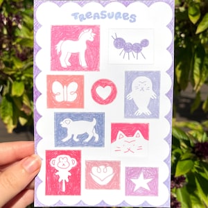 May include: A decorative card with the word "Treasures" in light blue script. The card features nine colorful, hand-drawn illustrations of a unicorn, ant, butterfly, heart, seal, dog, cat, monkey, and star, each in a square frame.