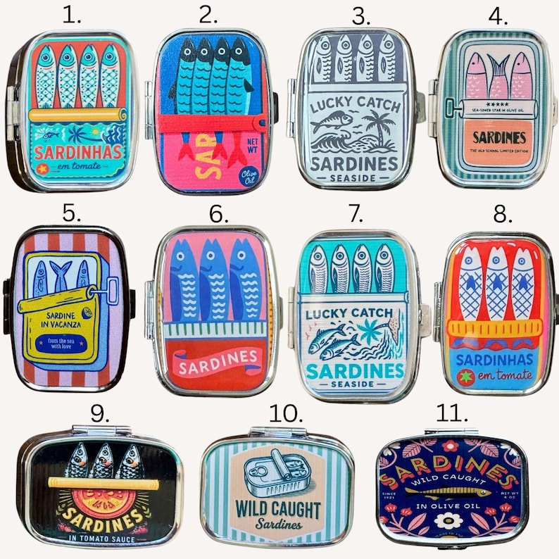 May include: A collection of eleven rectangular metal tins featuring colorful graphic illustrations of sardines. Each tin displays unique artwork with various sardine motifs, text labels like Sardinhas, Lucky Catch, and Wild Caught, and vibrant color palettes including red, blue, yellow, and pink.
