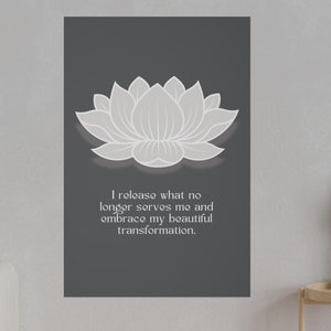 May include: A gray background with a white lotus flower and the text "I release what no longer serves me and embrace my beautiful transformation."
