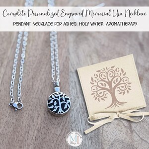 May include: A silver-colored pendant necklace with a round urn-shaped charm featuring a tree design. The necklace is displayed with a small beige pouch with a tree graphic and a cream-colored ribbon. Text on the image reads: Complete Personalized Engraved Memorial Urn Necklace.