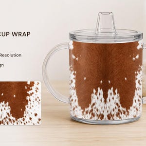 May include: A 12 oz sippy cup wrap with a brown and white cowhide pattern. The cup has a clear lid and handles. The dimensions are 9.3 inches by 4.3 inches. A matching rectangular wrap is also shown.