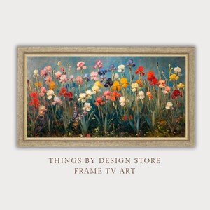 May include: A framed painting of a field of colorful irises. The flowers are in various shades of pink, purple, yellow, blue, and red. The background is a light blue sky.