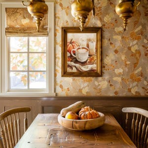 May include: A wooden table with a bowl of fruit, including a pumpkin, an apple, and a pear. The table is set with a wooden chair on each side. The wall behind the table is covered in a patterned wallpaper with a fall theme.